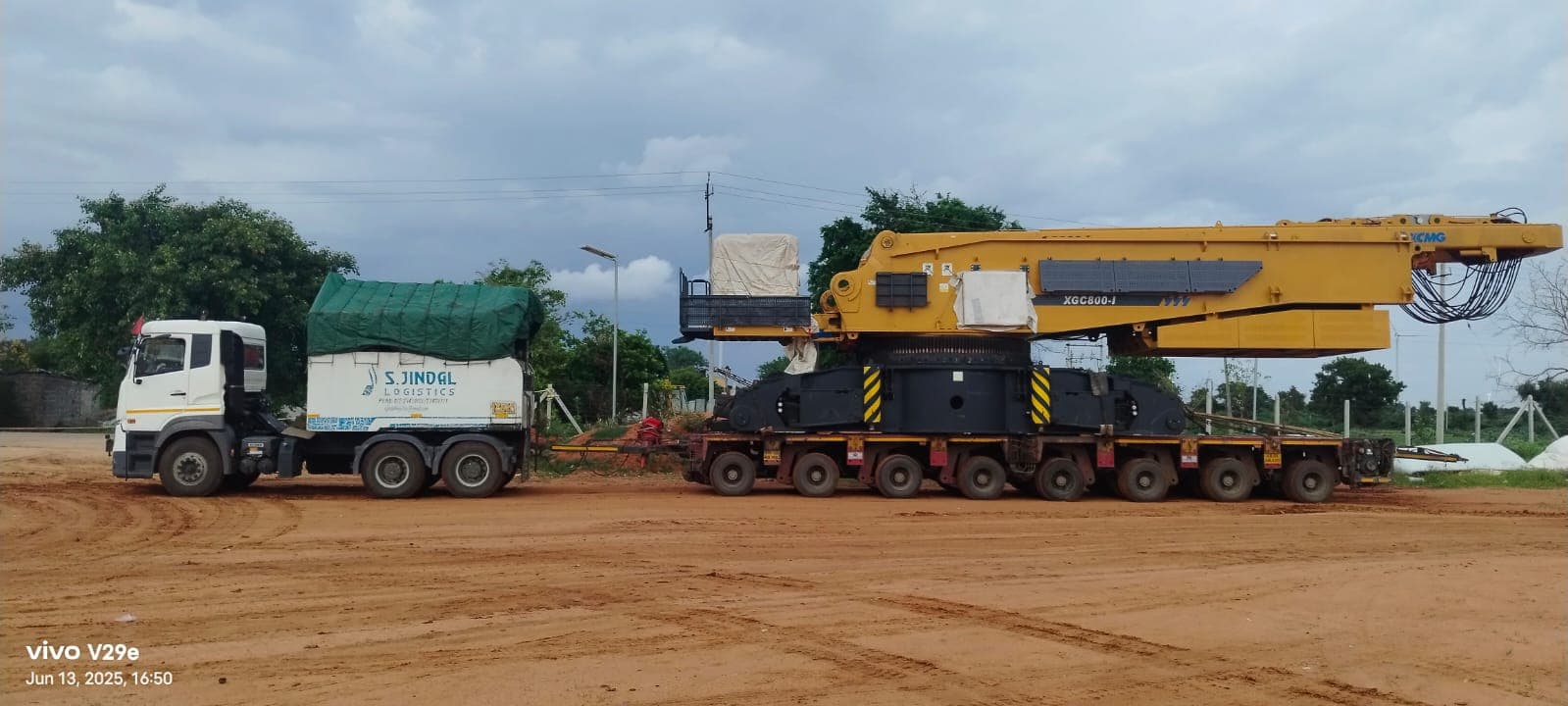 XCMG XGC800 crawler-crane superstructure on an 8-axle-line trailer.